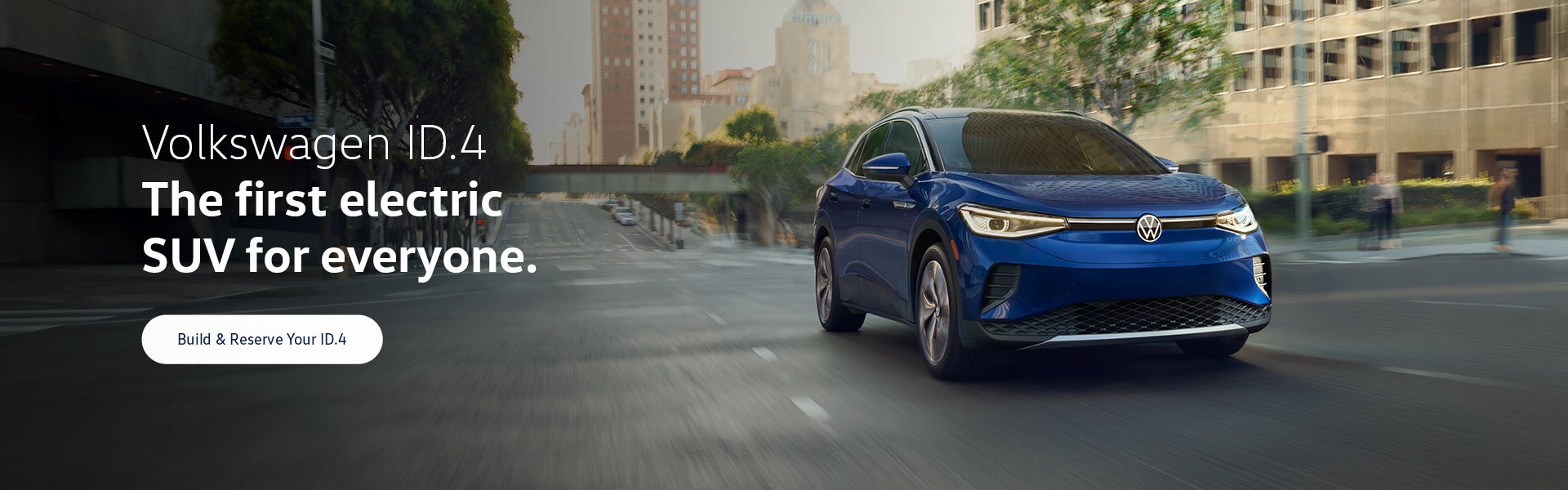 An ID.4 in Dusk Blue Metallic drives on an urban road.